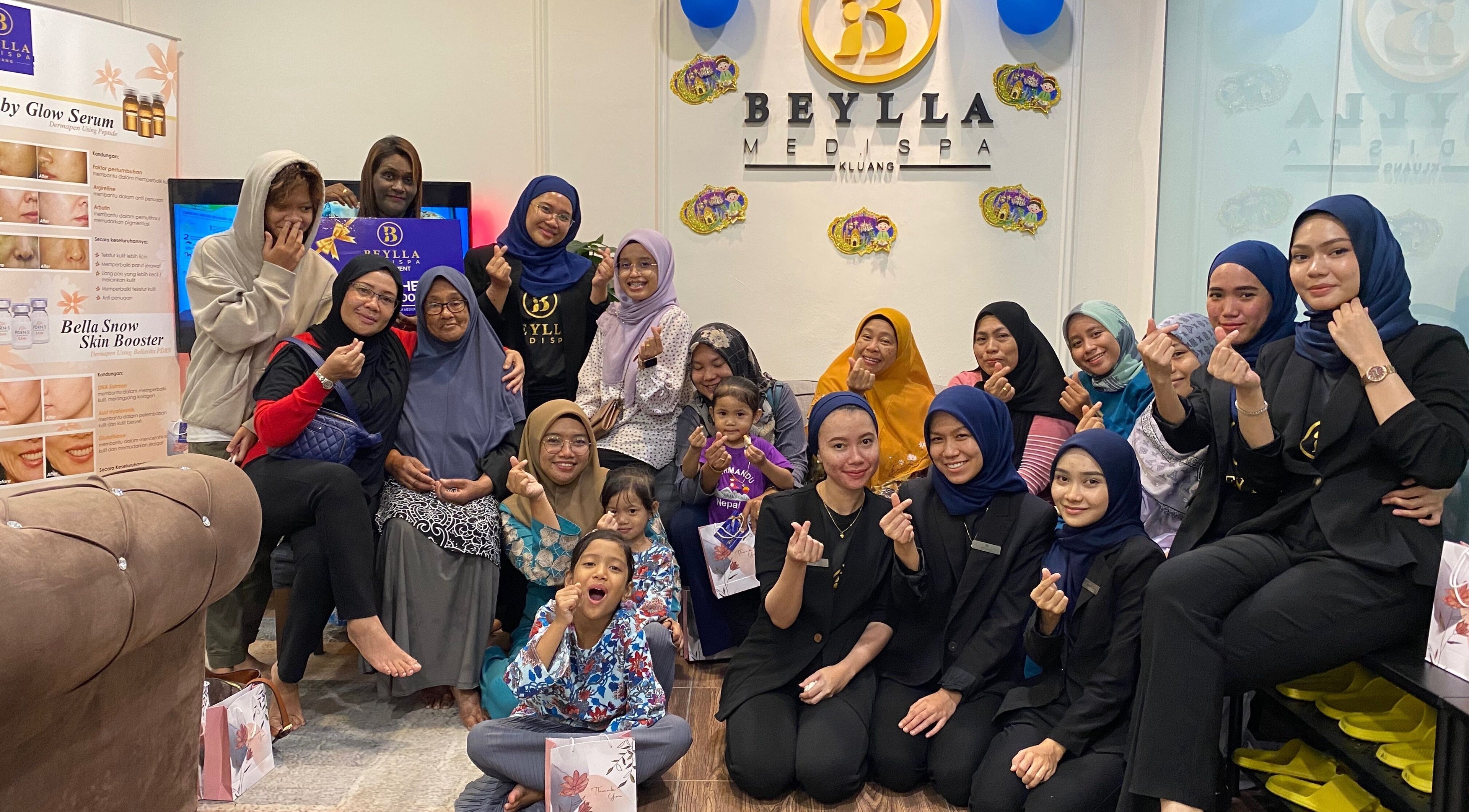 Group enjoying a joyful moment at Beylla Medispa Kluang in Kluang, Johor, MY, showcasing a vibrant atmosphere.