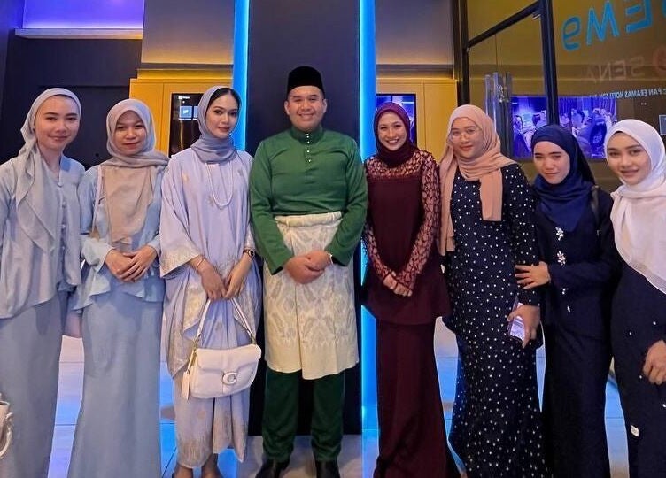 Stylish group at Beylla Medispa Kluang, Kluang, Johor, MY, showcasing vibrant attire and smiles.