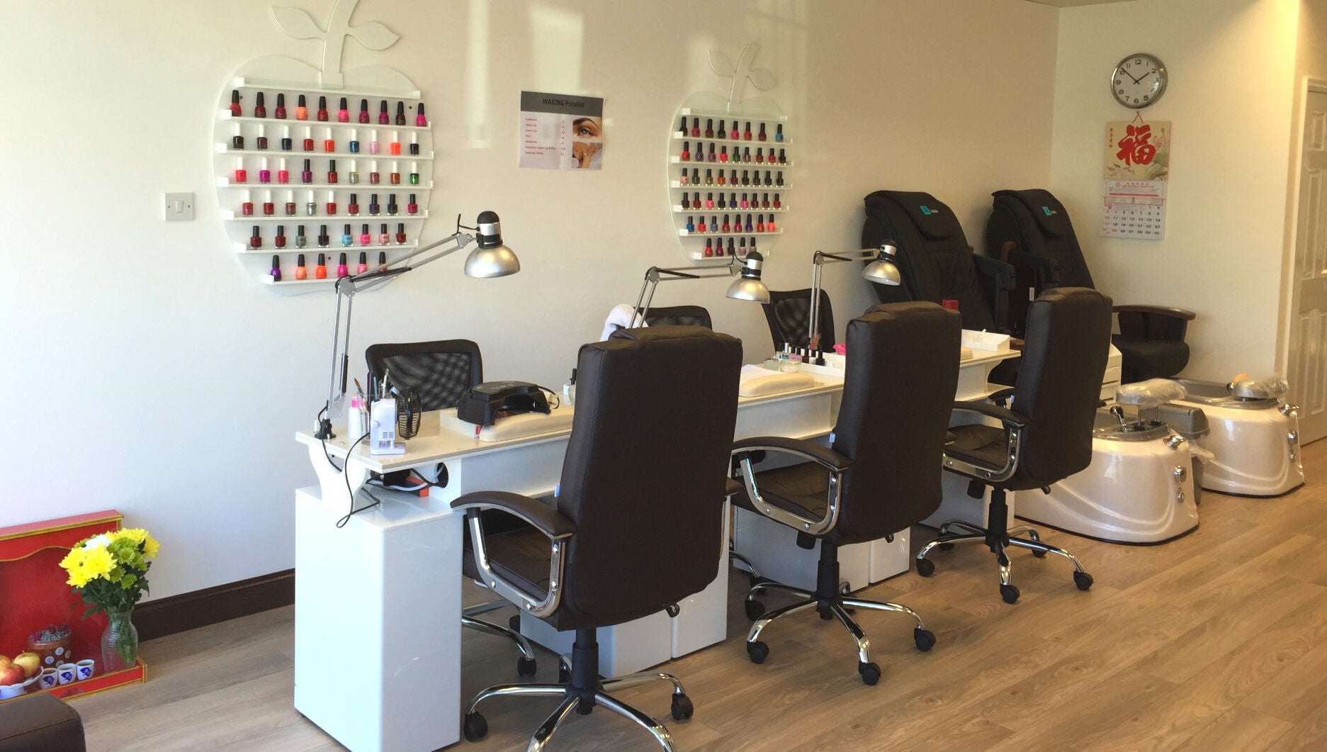 Pretty Nails salon in Sidcup, England, GB with sleek manicure stations and colorful polish display.