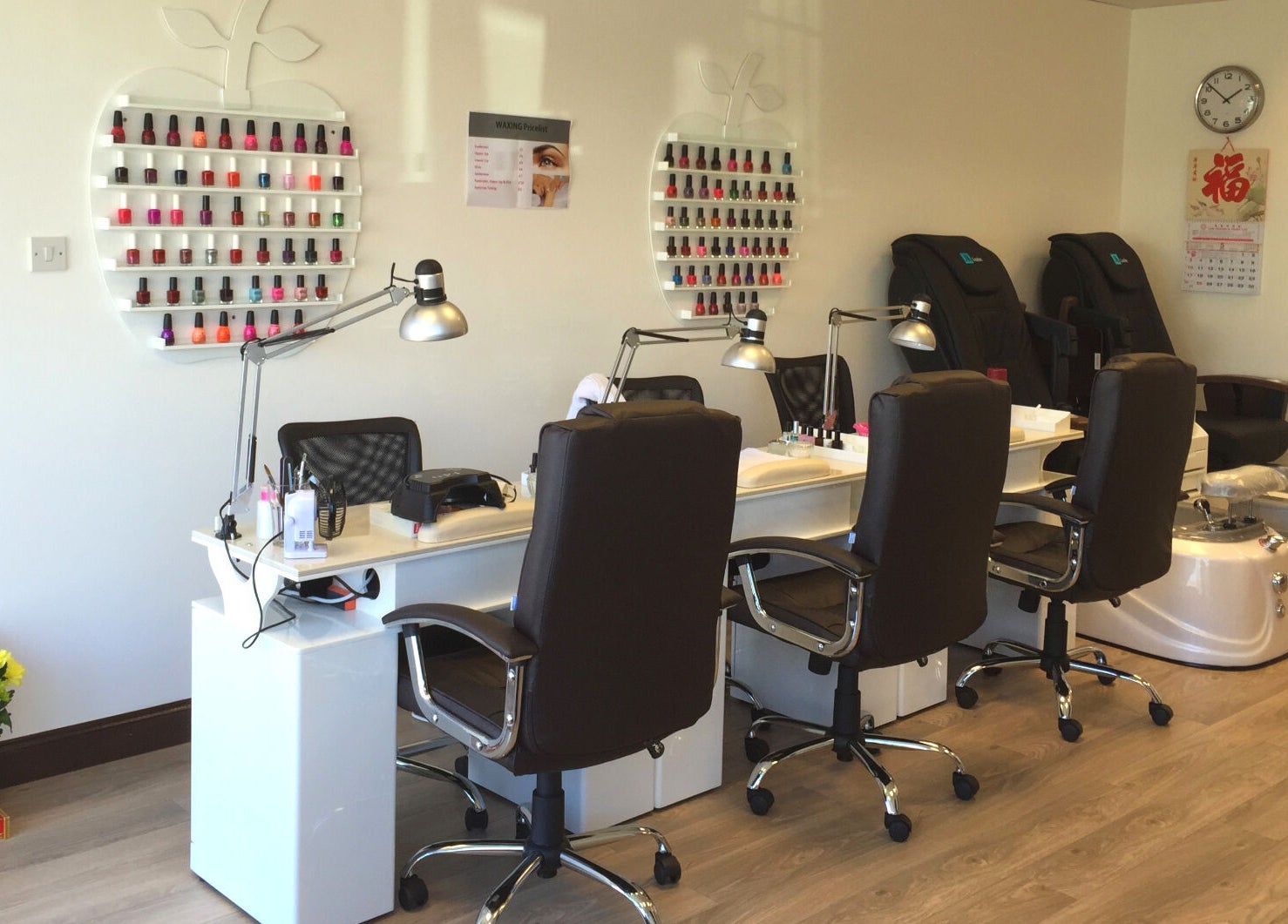 Pretty Nails salon in Sidcup, England, GB with sleek manicure stations and colorful polish display.
