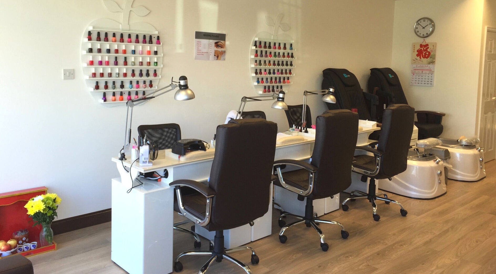 Pretty Nails salon in Sidcup, England, GB with sleek manicure stations and colorful polish display.