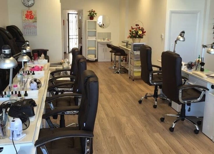 Interior of Pretty Nails in Sidcup, England, GB showcasing modern nail stations and elegant decor.