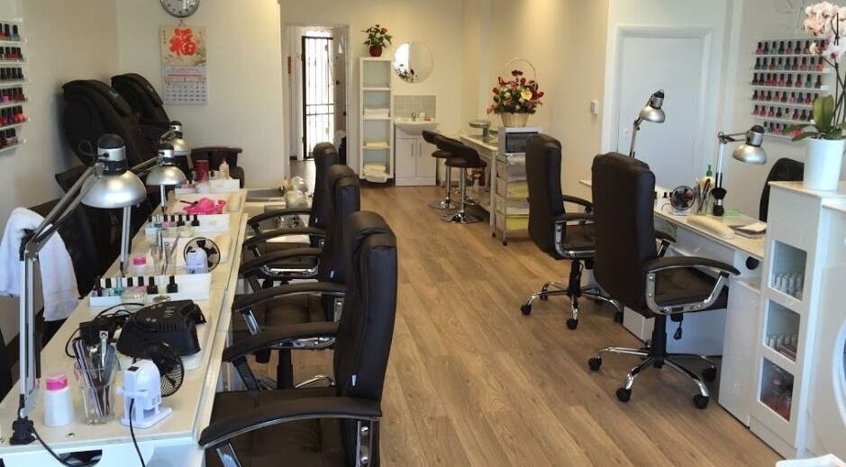 Interior of Pretty Nails in Sidcup, England, GB showcasing modern nail stations and elegant decor.