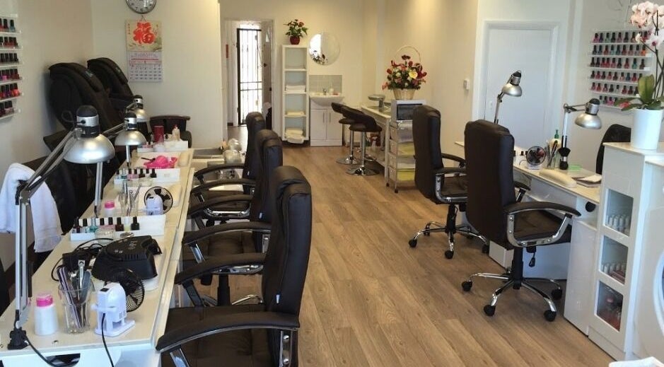Interior of Pretty Nails in Sidcup, England, GB showcasing modern nail stations and elegant decor.