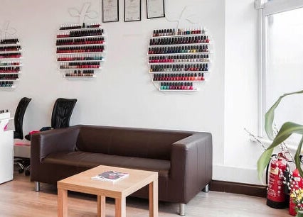 Cozy seating and nail polish display at Pretty Nails, Sidcup, England, GB. Perfect for relaxation and beauty care.