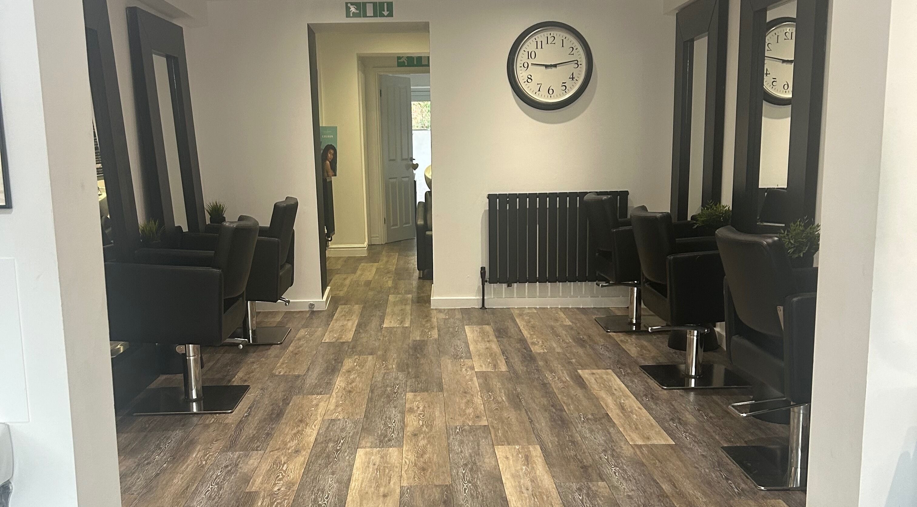 Modern salon chairs and mirrors at Hair and Beauty Gallery, Blackburn, England, GB.