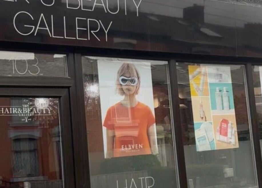 Front view of Hair and Beauty Gallery in Blackburn, England, showcasing stylish window displays.
