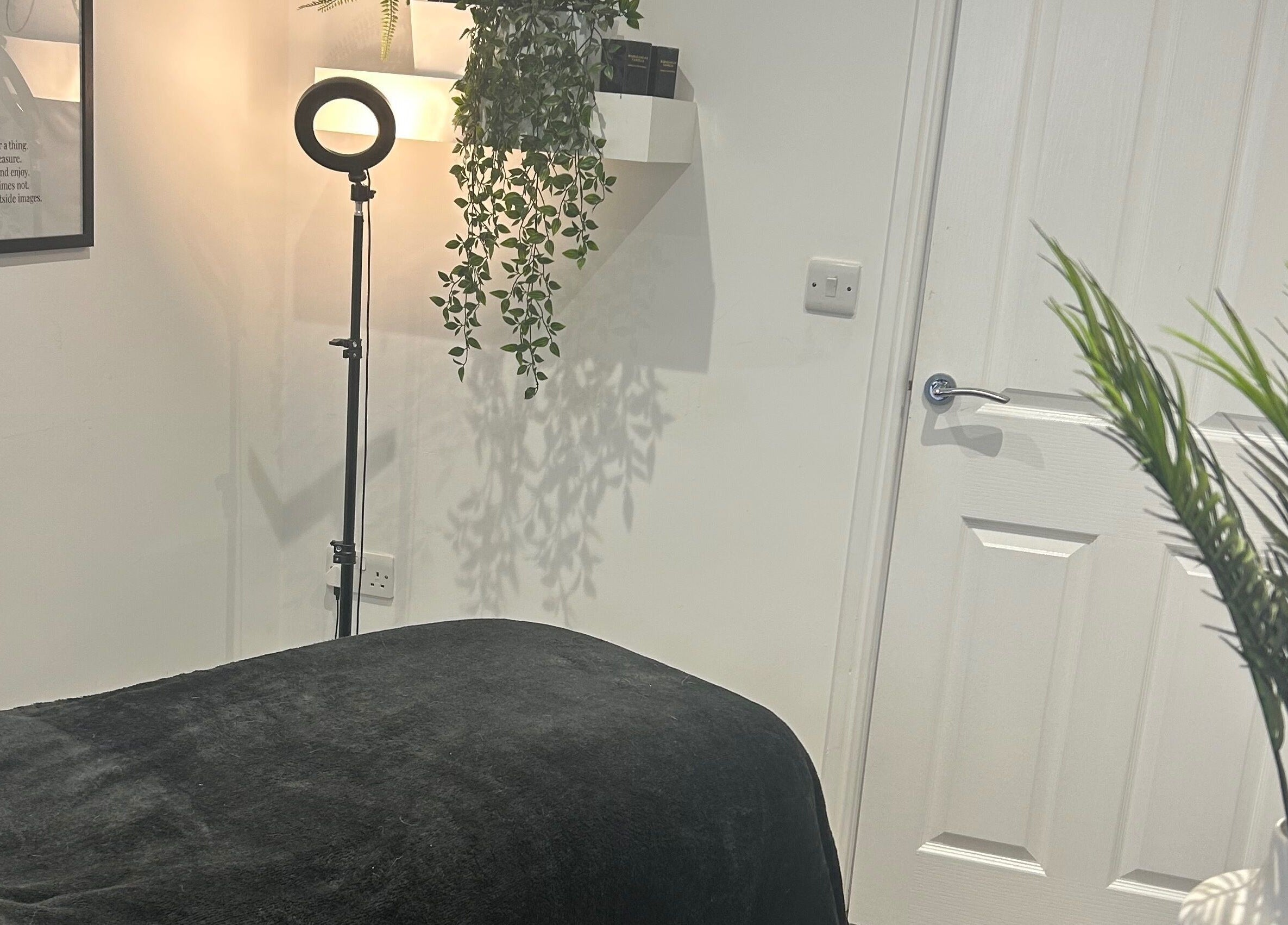 Relaxing treatment room at Hair and Beauty Gallery, Blackburn, England with cozy lighting and soothing décor.