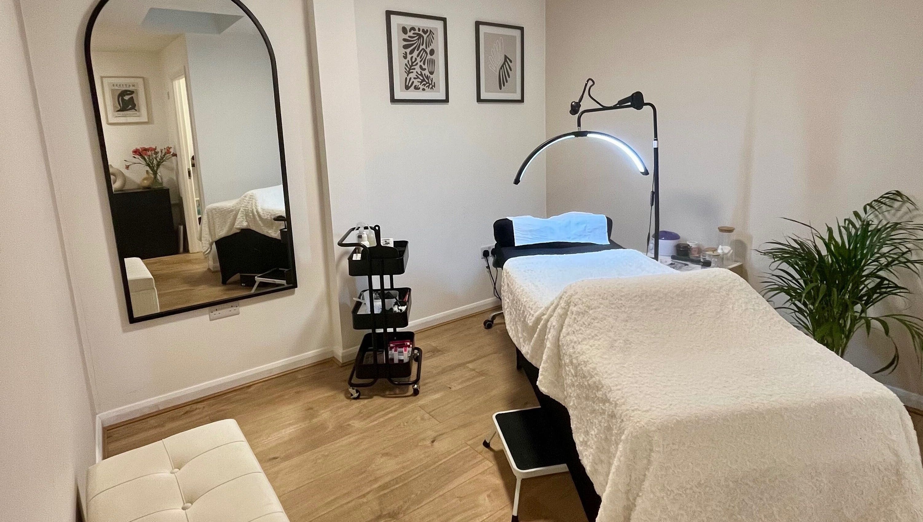 Cozy treatment room at Lashed in London, London, England, GB with a comfortable bed and serene decor.
