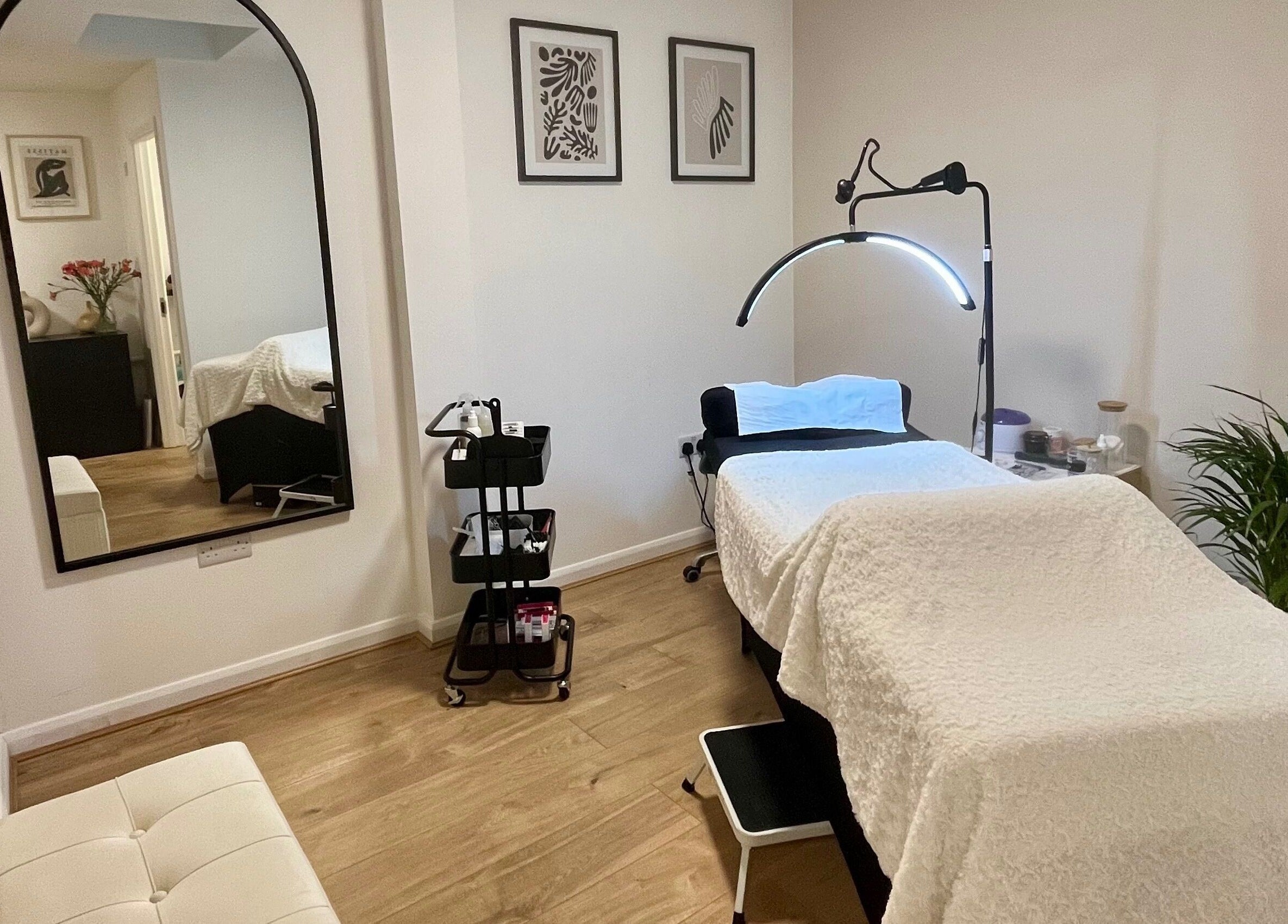 Cozy treatment room at Lashed in London, London, England, GB with a comfortable bed and serene decor.