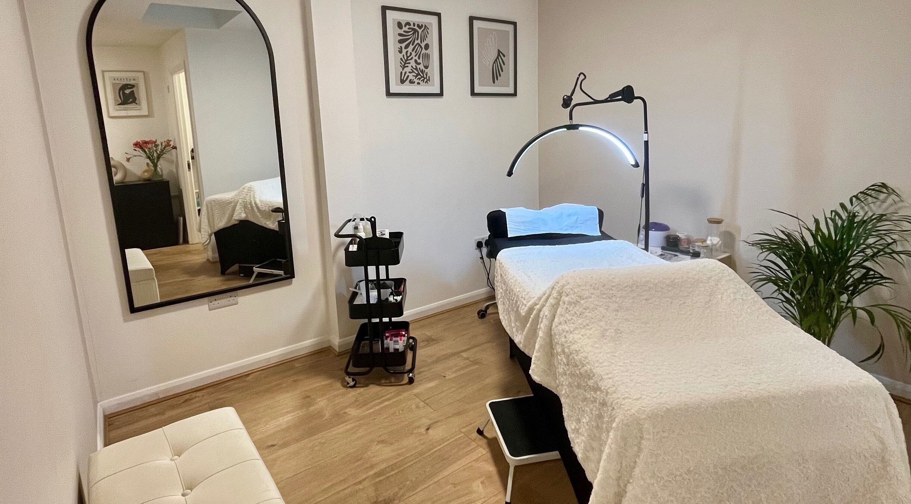 Cozy treatment room at Lashed in London, London, England, GB with a comfortable bed and serene decor.