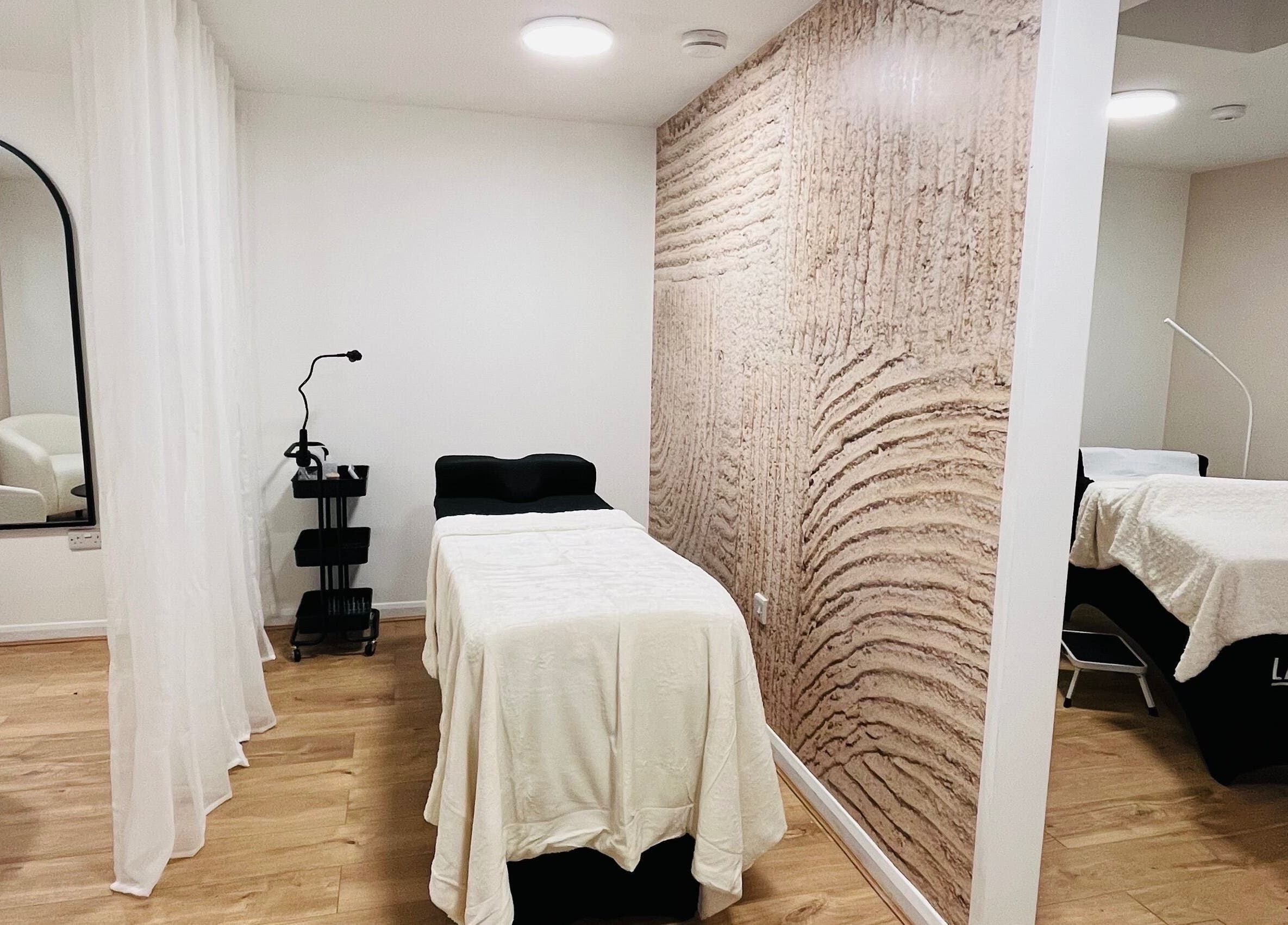 Tranquil therapy room at Lashed in London, London, England, GB with elegant decor and massage tables.