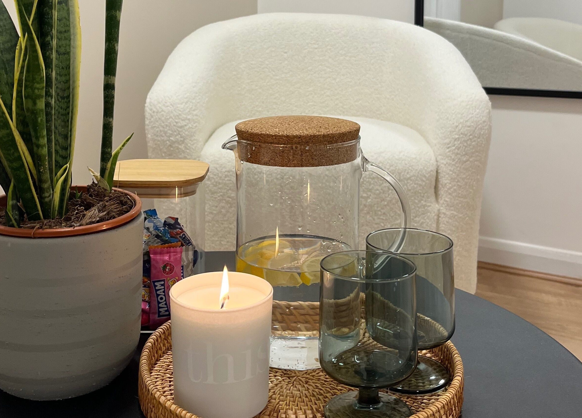 Relaxing lounge at Lashed in London with plant, pitcher, and candle in London, England, GB.