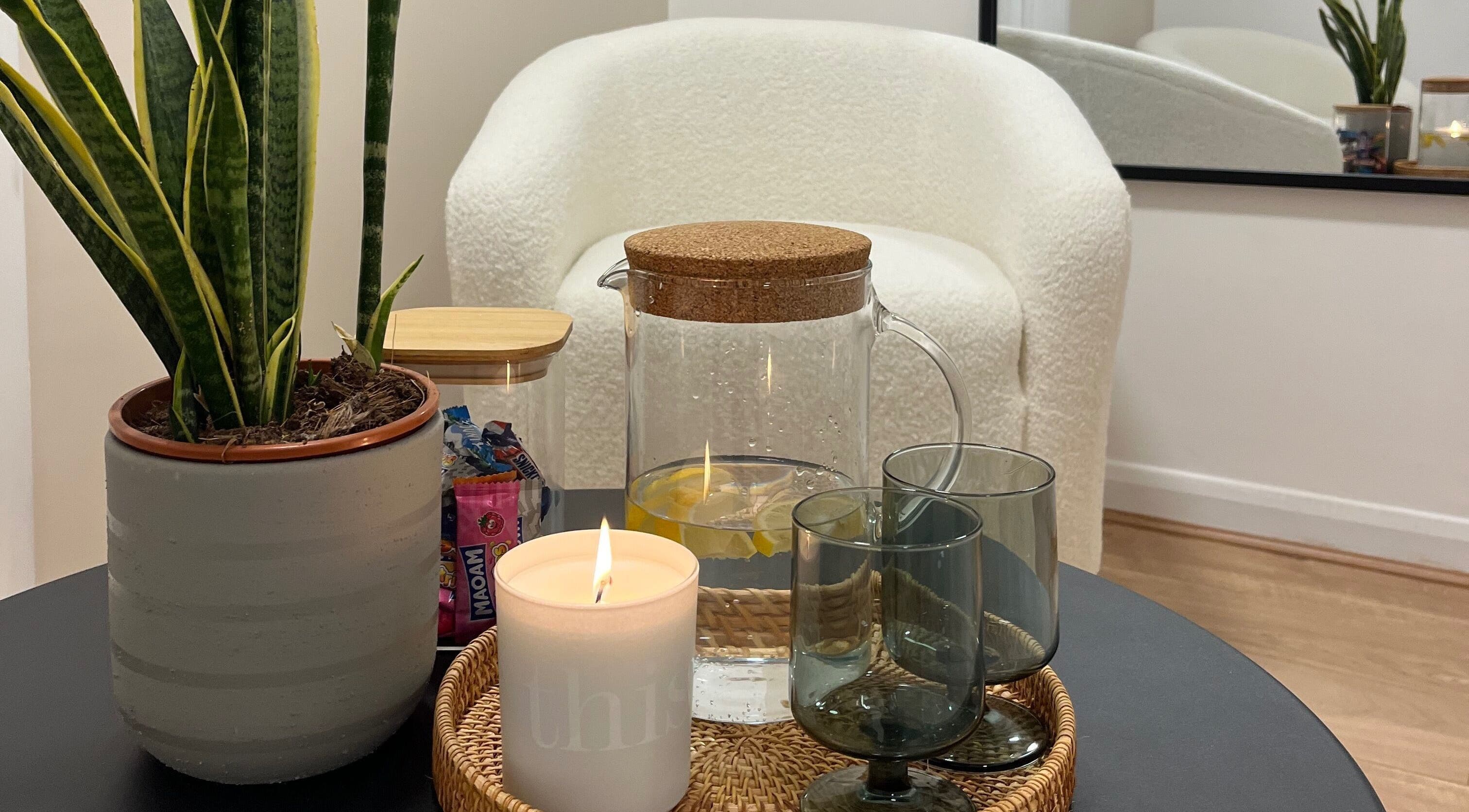 Relaxing lounge at Lashed in London with plant, pitcher, and candle in London, England, GB.