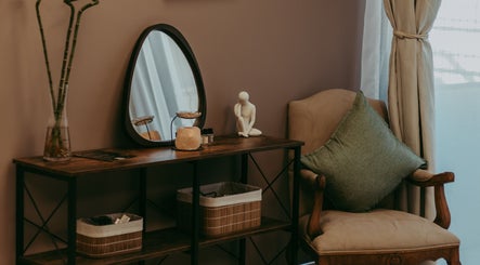 Relaxing corner at Haven Spa Namibia in Windhoek, Khomas Region, NA, featuring a plush chair and elegant decor.