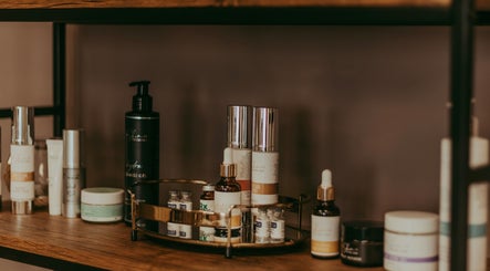 Luxurious skincare products on wooden shelf at Haven Spa Namibia, Windhoek, Khomas Region, NA.