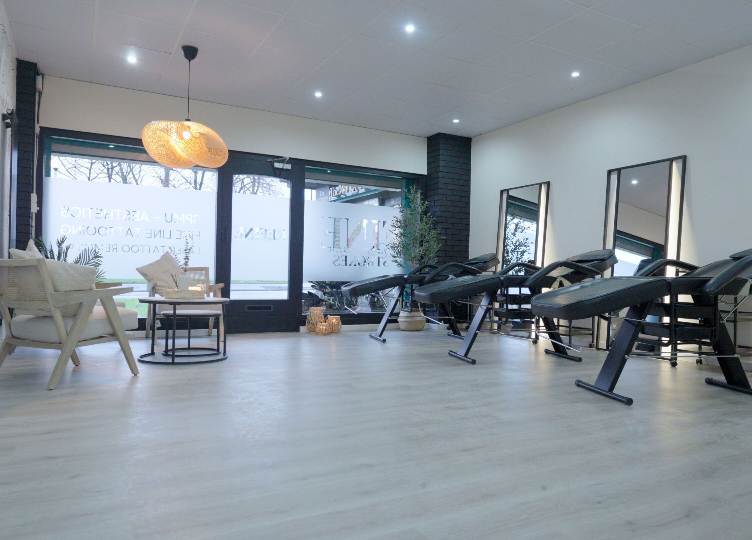 Fine Strokes SPMU and Aesthetics in Chadderton, England, GB featuring sleek treatment chairs and decor.