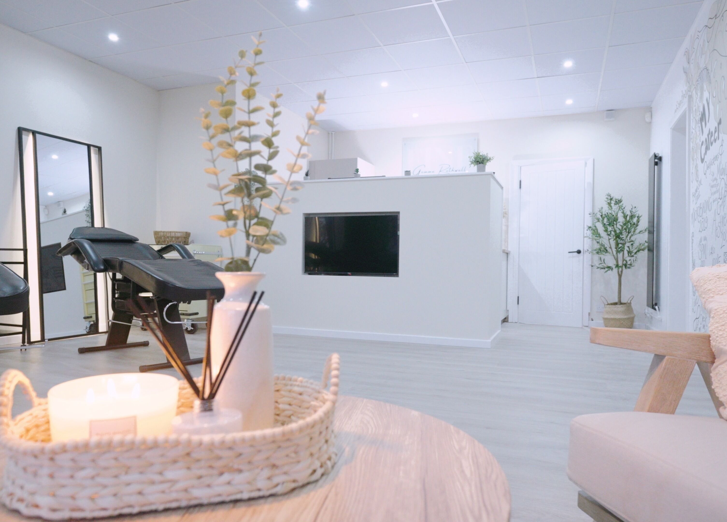 Fine Strokes SPMU and Aesthetics lounge area in Chadderton, England offers a serene ambiance with cozy seating.