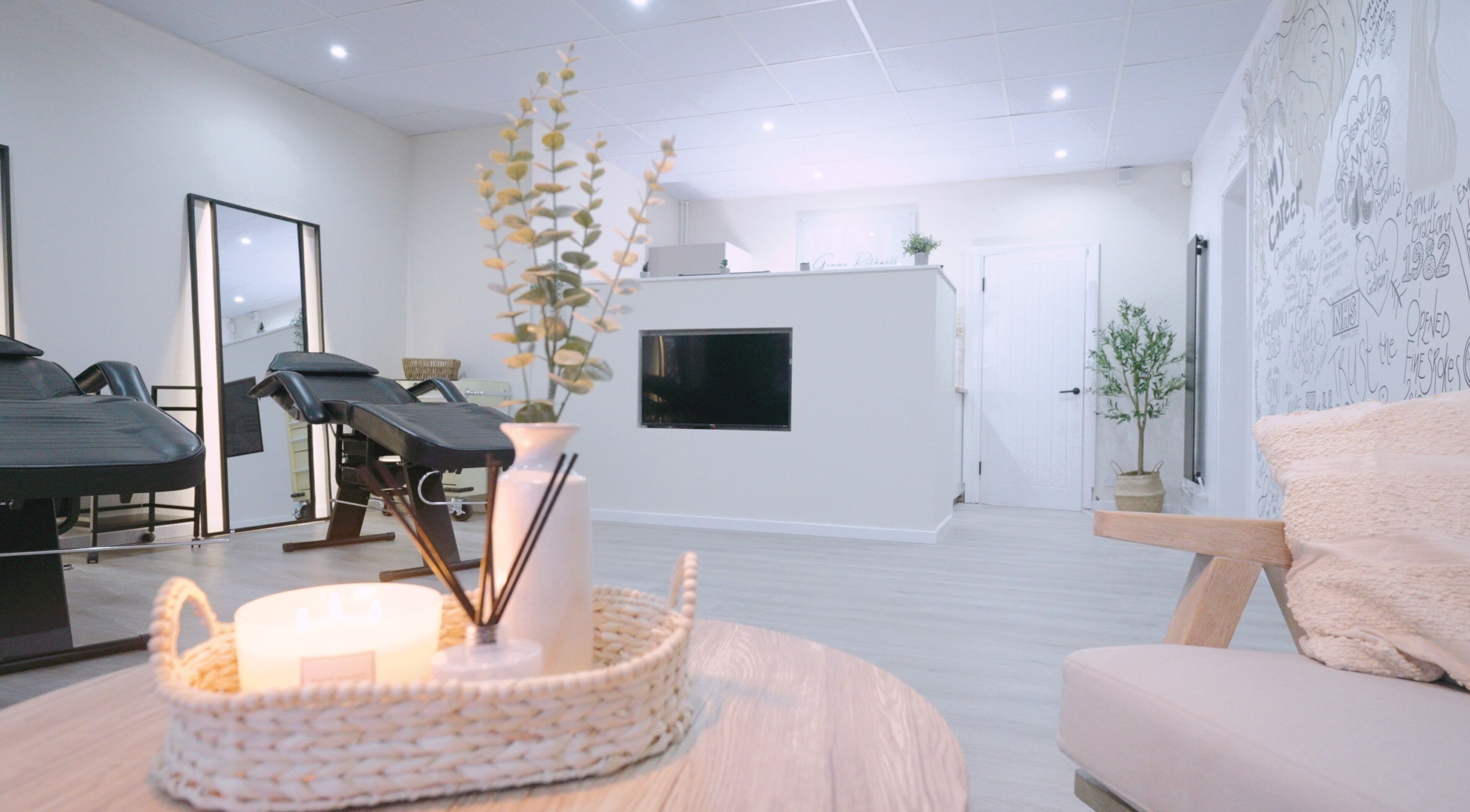 Fine Strokes SPMU and Aesthetics lounge area in Chadderton, England offers a serene ambiance with cozy seating.