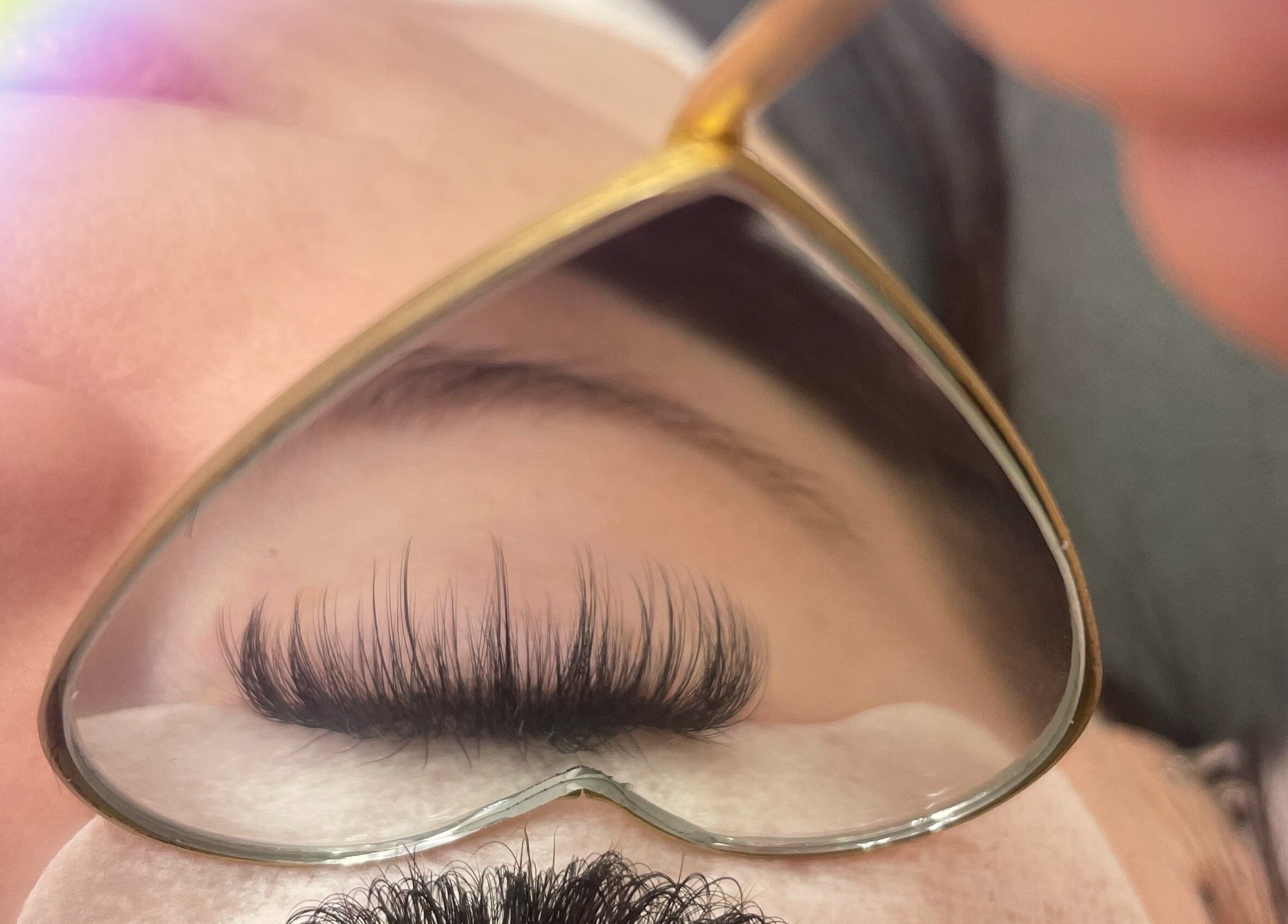 Close-up of eyelash extensions at Minxy Lash, Warrington, England, GB with heart-shaped mirror reflection.