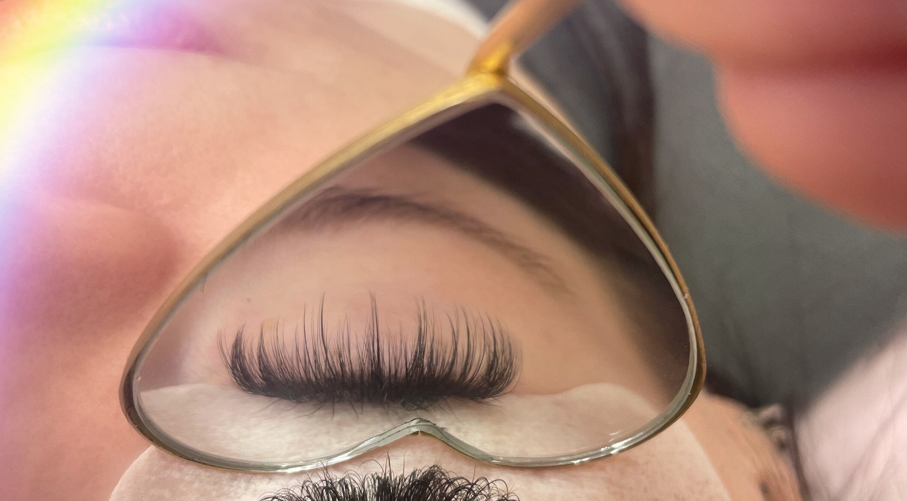 Close-up of eyelash extensions at Minxy Lash, Warrington, England, GB with heart-shaped mirror reflection.