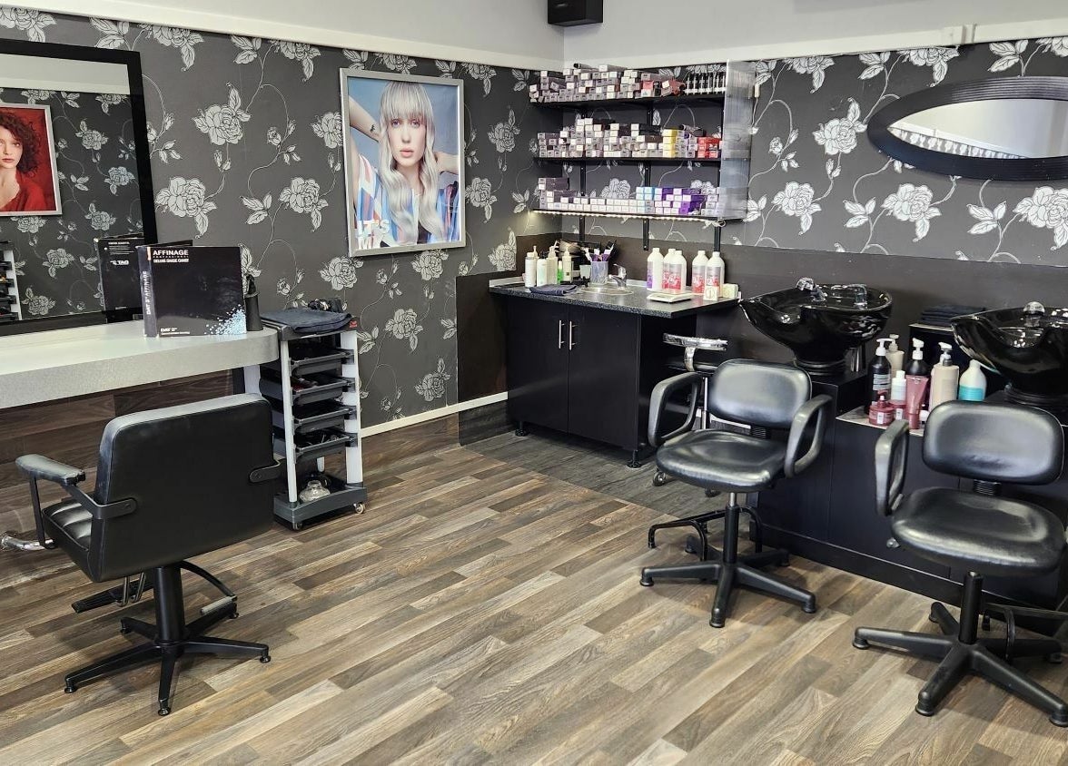 Modern salon interior of Chris and Co Hair Design in Pukekohe, Auckland, NZ showcasing stylish decor and equipment.
