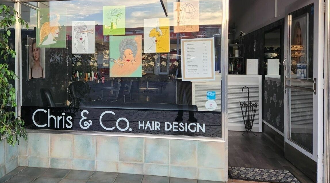 Front view of Chris and Co Hair Design in Pukekohe, Auckland, NZ, showcasing decorative window art.