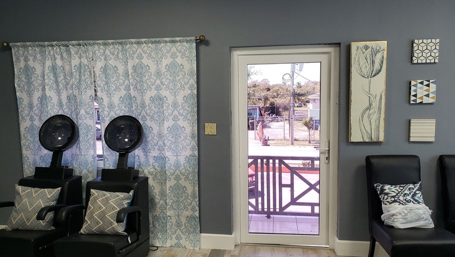 Relaxing salon chairs by a window at The Goddess Loft, Nassau, New Providence, BS.