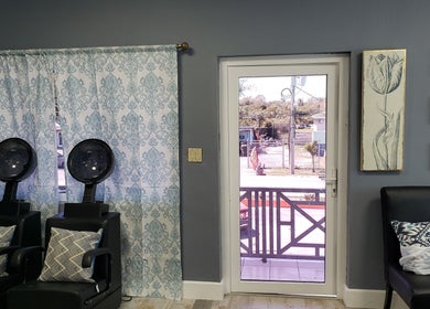 Relaxing salon chairs by a window at The Goddess Loft, Nassau, New Providence, BS.