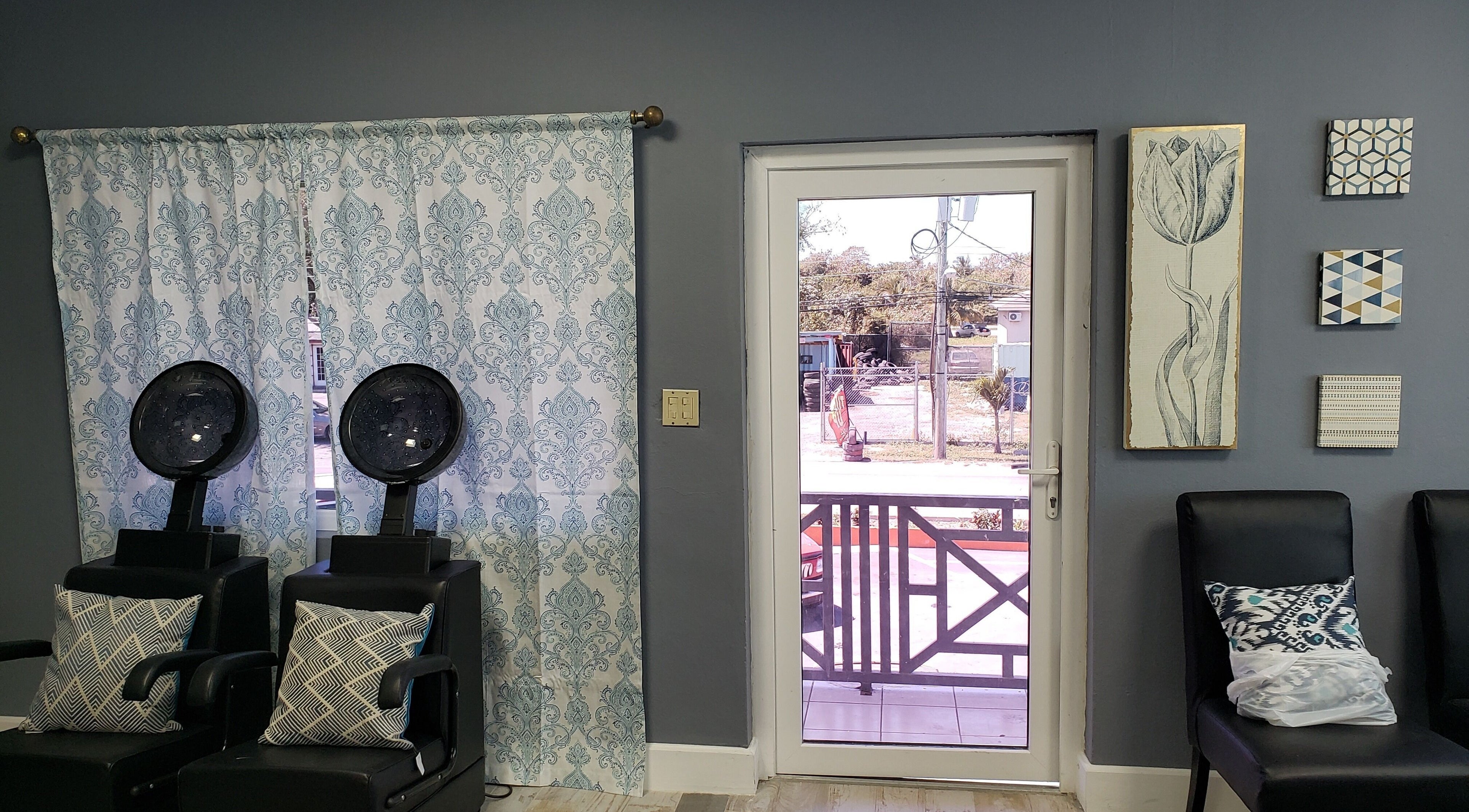 Relaxing salon chairs by a window at The Goddess Loft, Nassau, New Providence, BS.