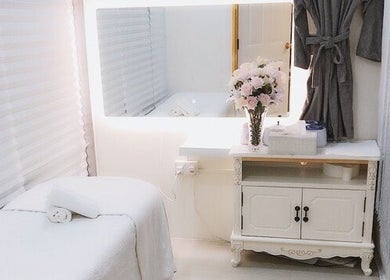 Relaxing treatment room at Best Beauty Hair Removal, Singapore, Singapore, SG, featuring elegant decor.
