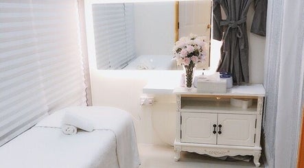 Relaxing treatment room at Best Beauty Hair Removal, Singapore, Singapore, SG, featuring elegant decor.
