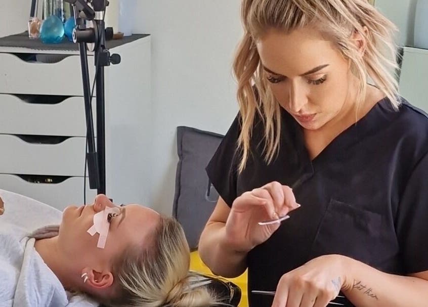 Technician applying lashes at RD Nails & Beauty Clinic, Peterborough, Cambridgeshire, GB.