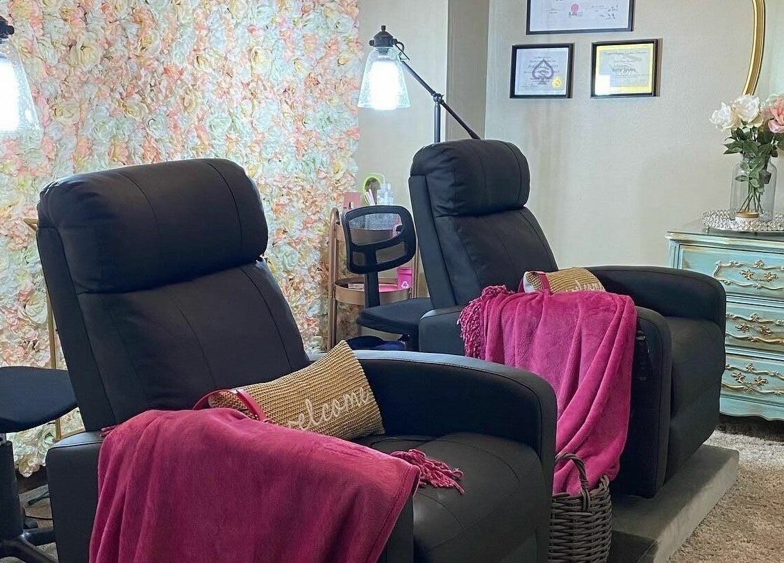 Relaxing seating area at Lena Brows and Beauty Bar in Sandusky, Ohio, US, featuring plush chairs and elegant decor.