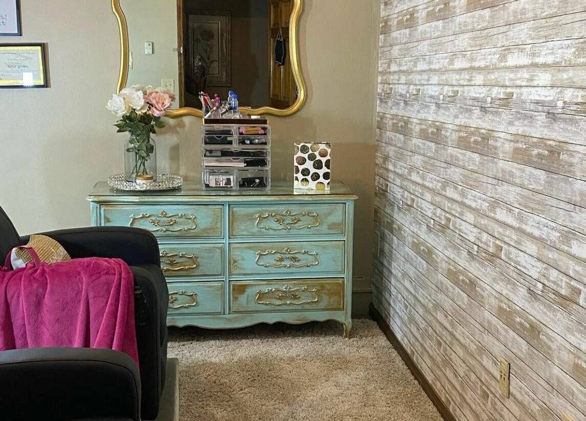 Chic beauty station at Lena Brows and Beauty Bar, Sandusky, Ohio, US with plush chairs and vintage decor.