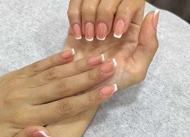 French manicure at Naya Saloon in Sanabis, Muḥāfaẓat Al-ʿāṣimah, BH. Perfectly polished nails on display.