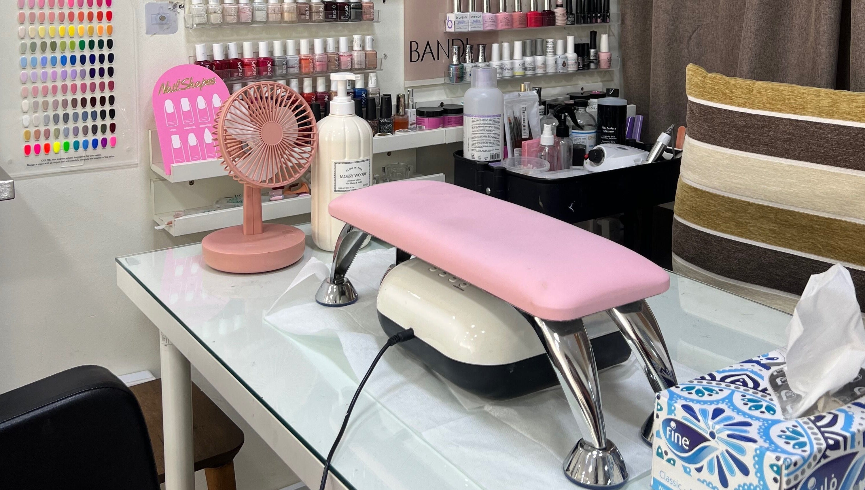 Nail art station at Naya Saloon, Sanabis, Muḥāfaẓat Al-ʿāṣimah, BH, with polish and tools.