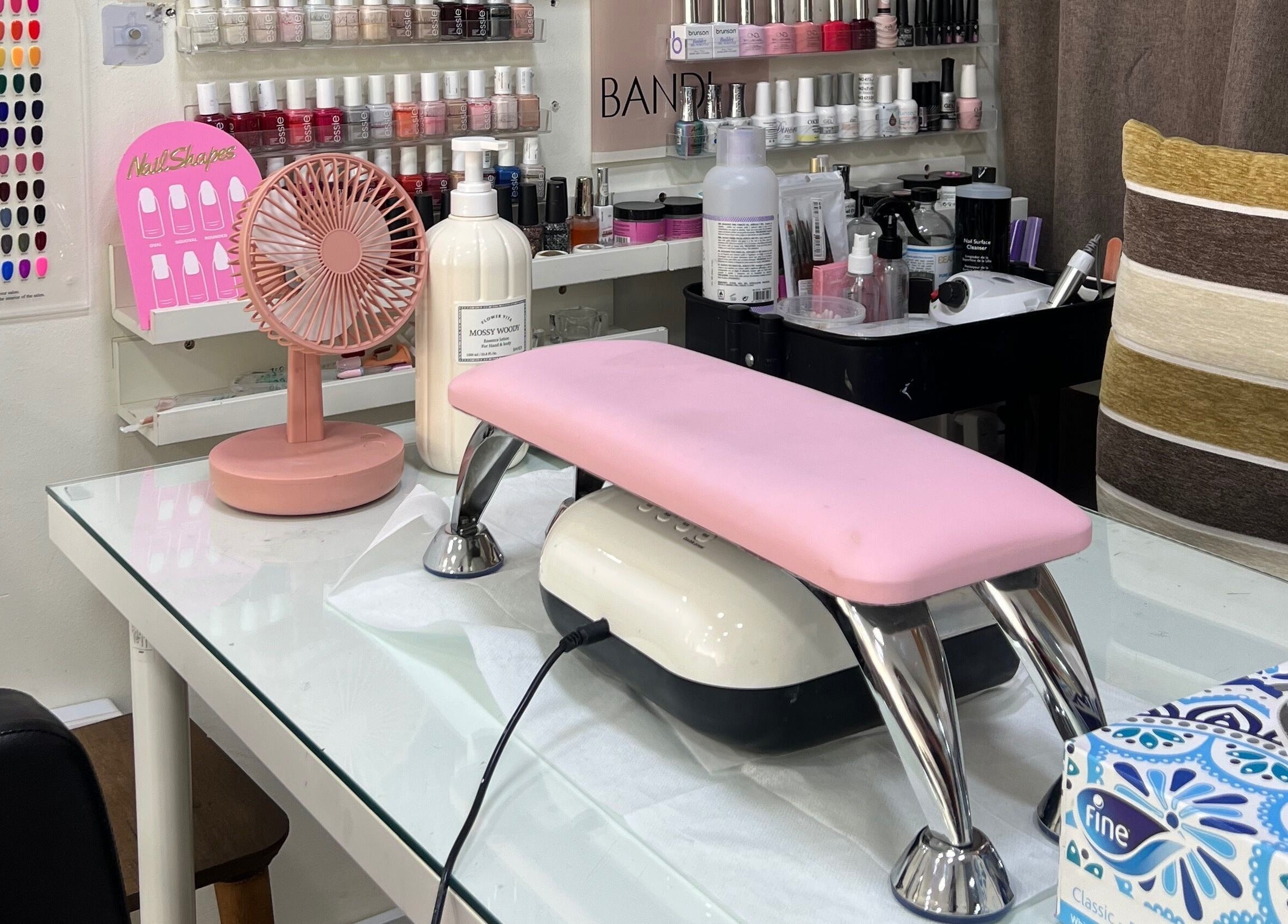 Nail art station at Naya Saloon, Sanabis, Muḥāfaẓat Al-ʿāṣimah, BH, with polish and tools.