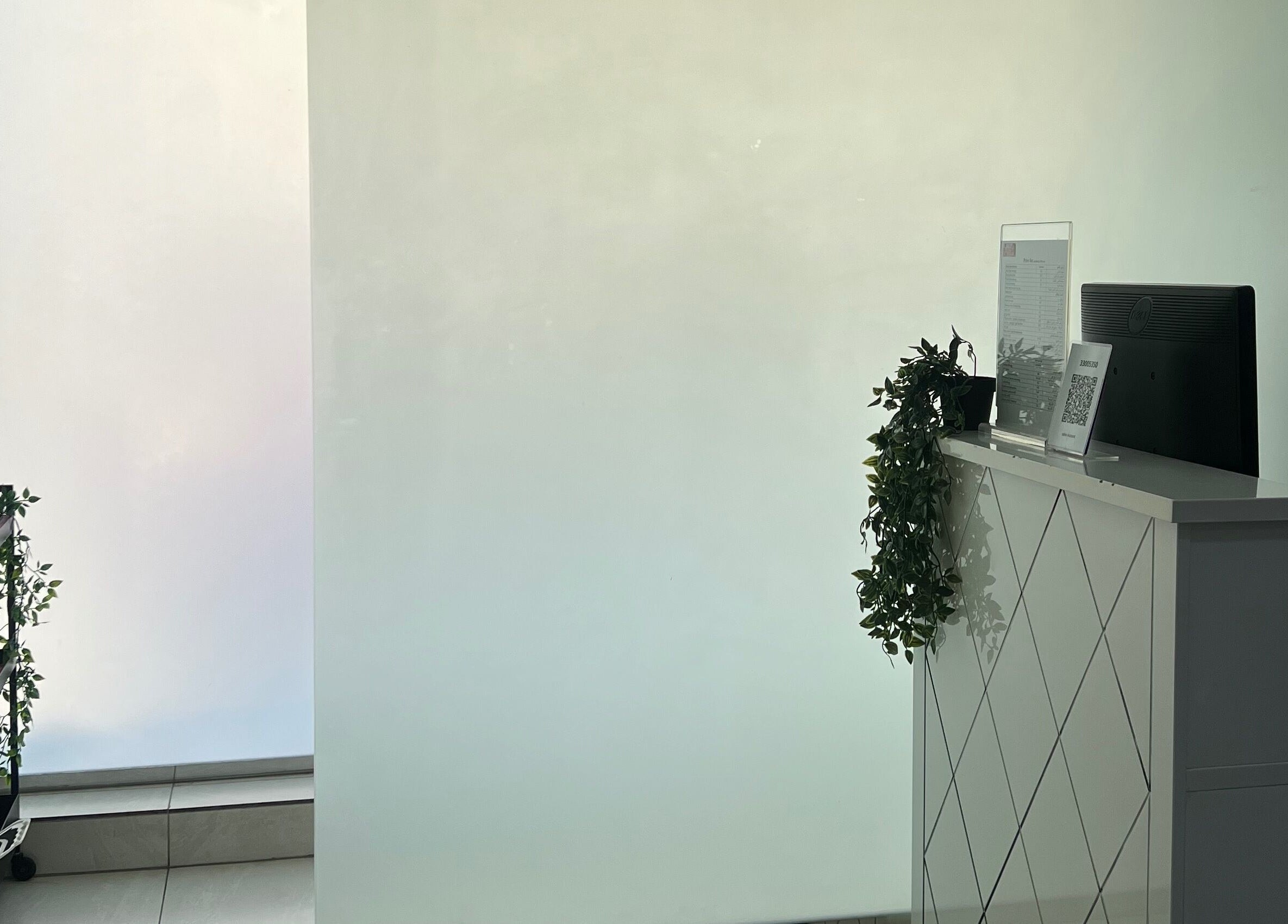 Modern reception area at Naya Saloon in Sanabis, Muḥāfaẓat Al-ʿāṣimah, BH with stylish decor.