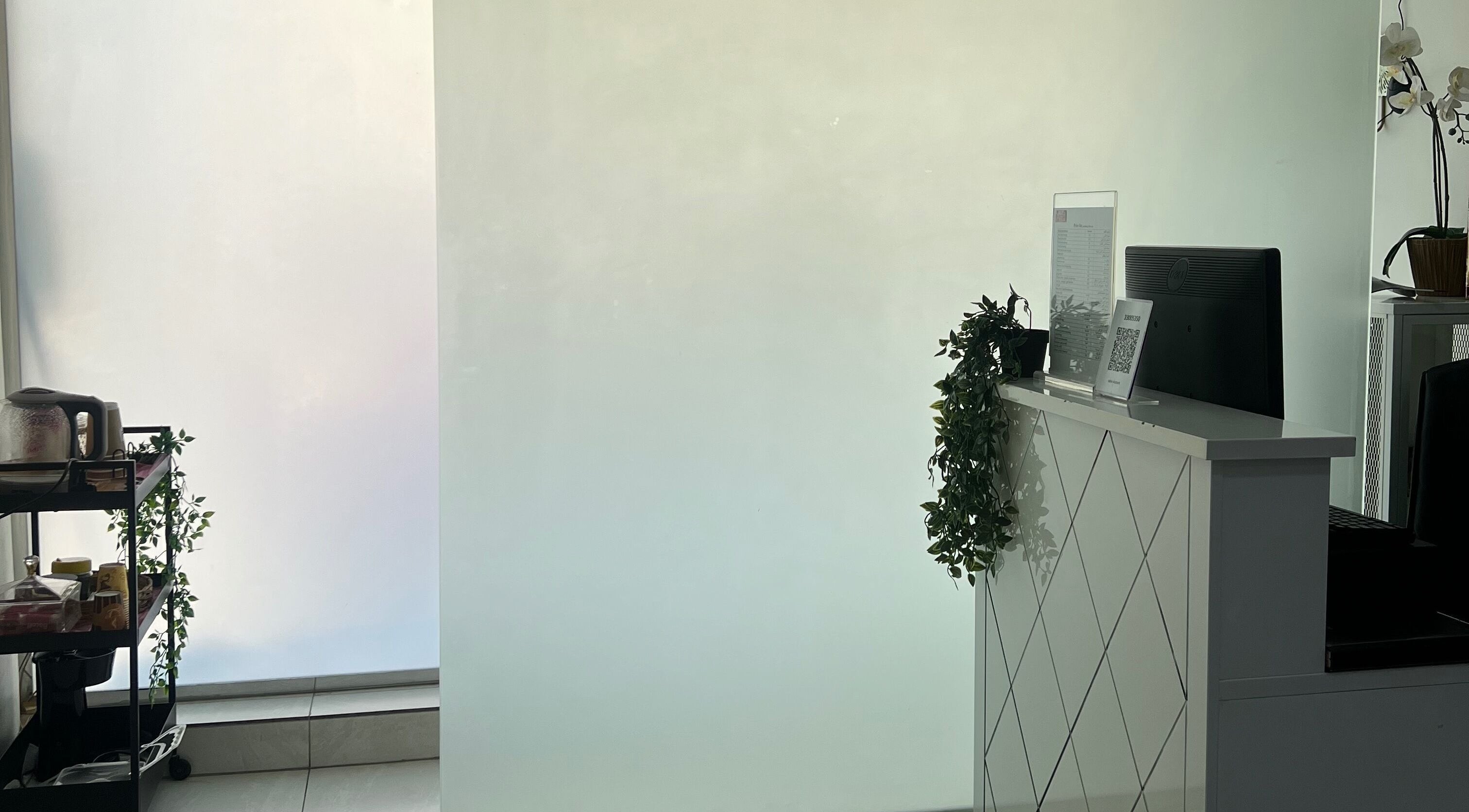 Modern reception area at Naya Saloon in Sanabis, Muḥāfaẓat Al-ʿāṣimah, BH with stylish decor.