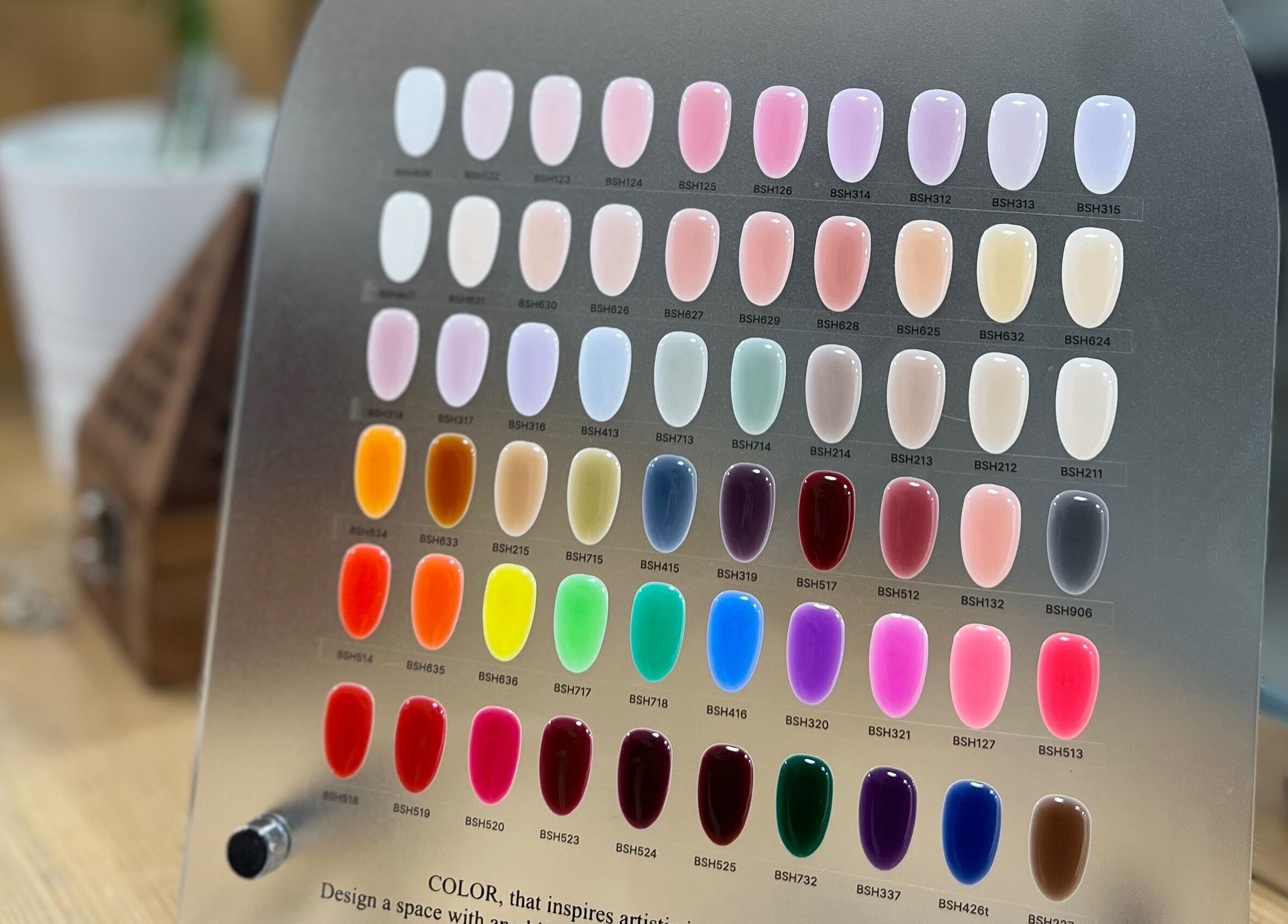 Colorful nail polish display at Naya Saloon, Sanabis, Muḥāfaẓat Al-ʿāṣimah, BH highlighting shade variety.