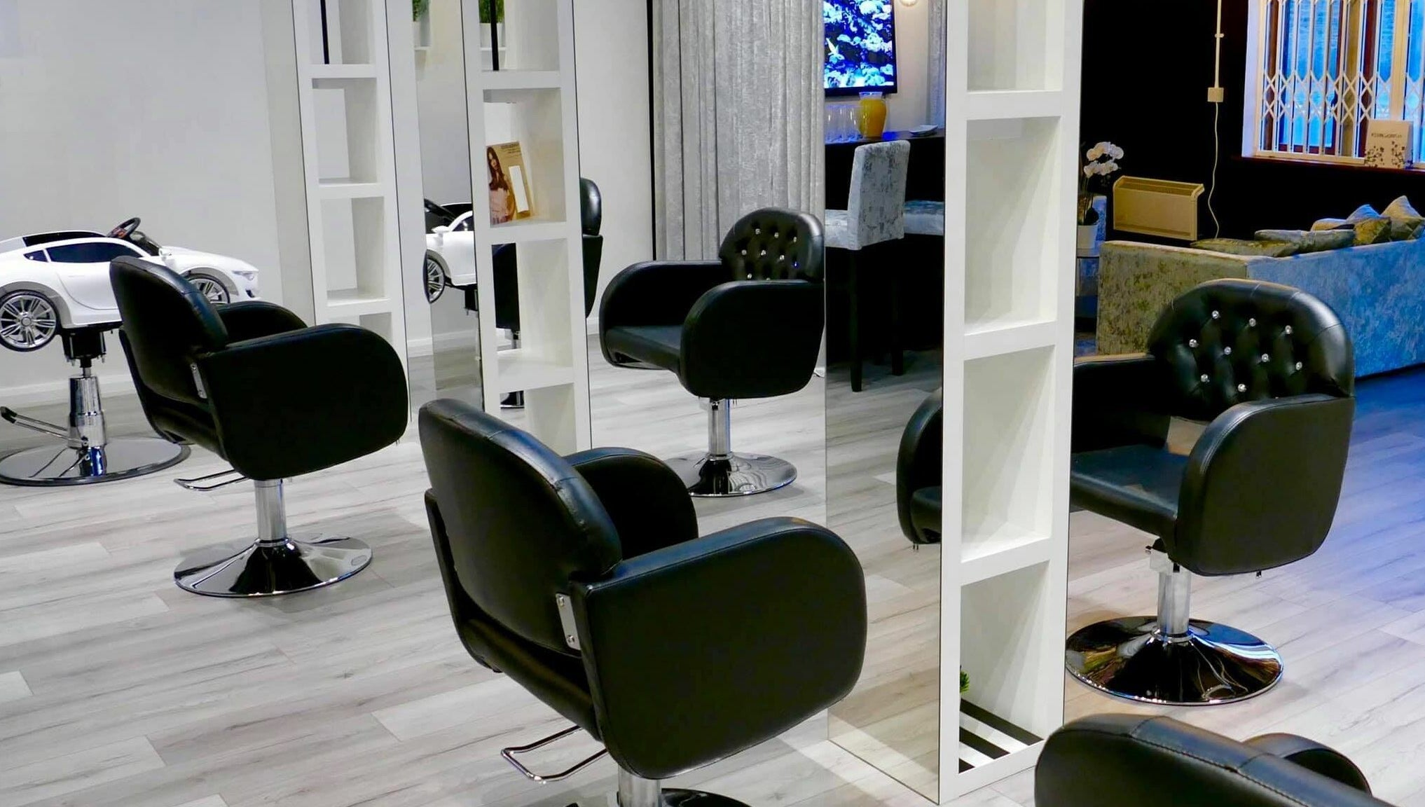 Modern salon interior with black chairs at The Salt Room, Sowerby Bridge, England, GB.