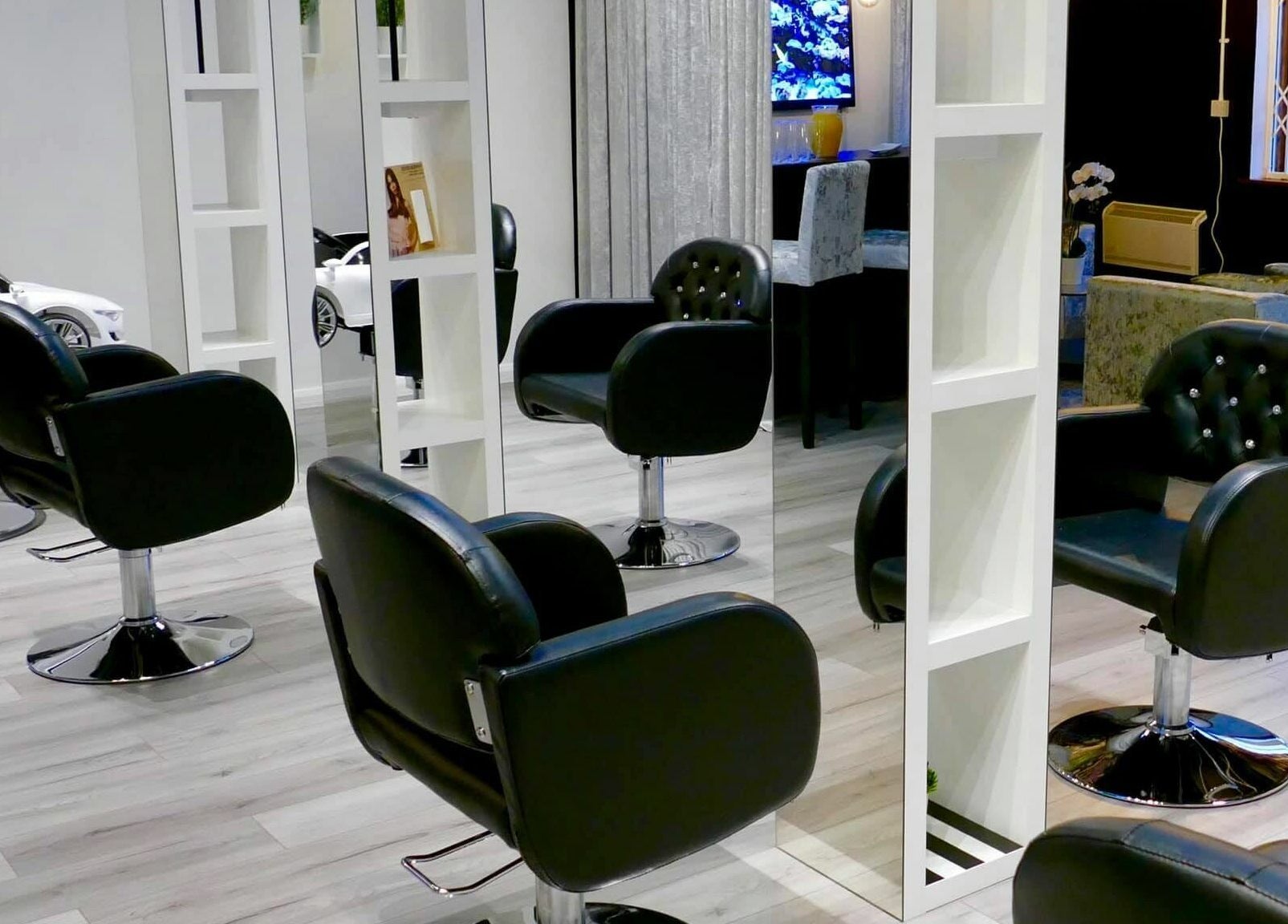 Modern salon interior with black chairs at The Salt Room, Sowerby Bridge, England, GB.