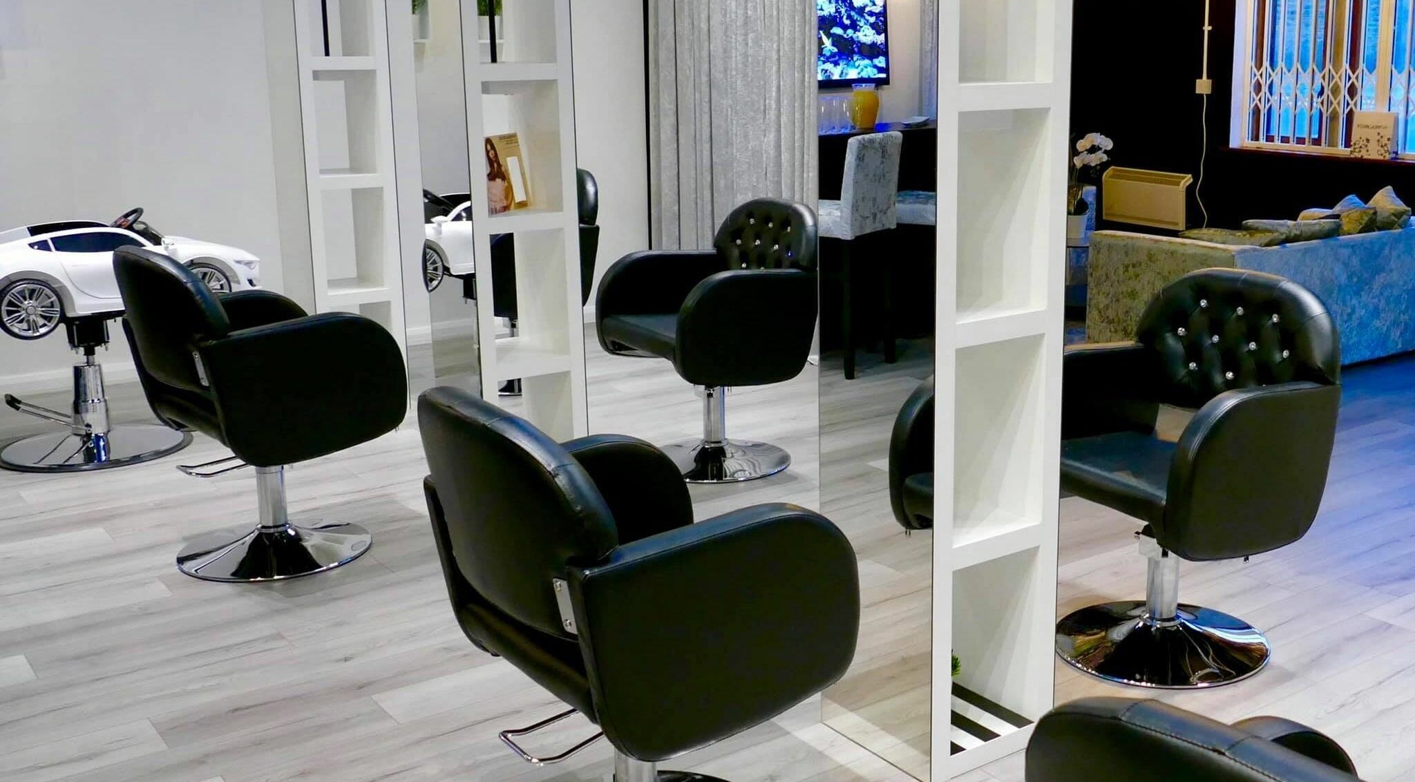 Modern salon interior with black chairs at The Salt Room, Sowerby Bridge, England, GB.