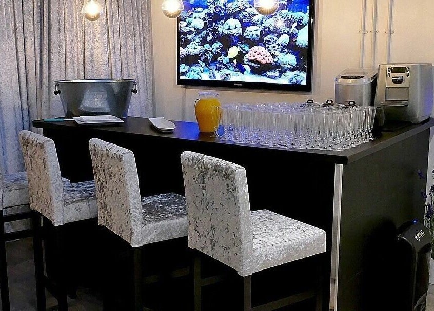 Chic bar area at The Salt Room, Sowerby Bridge, England, featuring plush seats and ambient lighting.