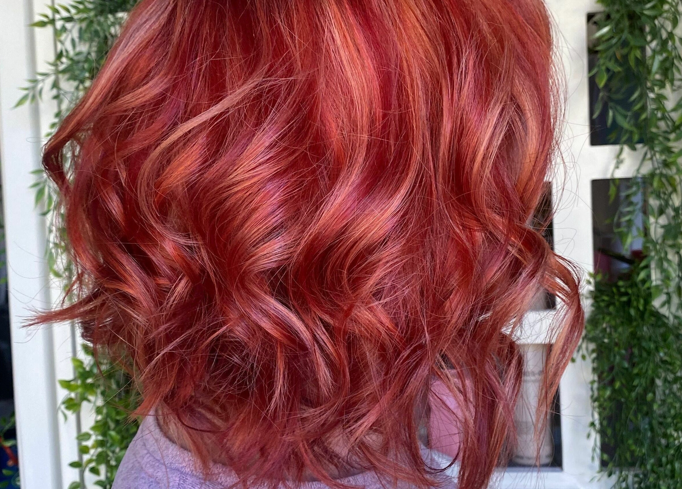 Vibrant red curls styled beautifully at The Salt Room, Sowerby Bridge, England, GB.