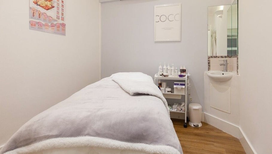 Serene treatment room at Farrah Brows & Aesthetic at SkinFit Clinic, Hampton, England, GB, offering relaxation.