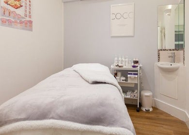 Serene treatment room at Farrah Brows & Aesthetic at SkinFit Clinic, Hampton, England, GB, offering relaxation.