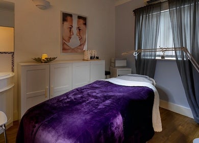 Calm treatment room at Farrah Brows & Aesthetic at SkinFit Clinic, Hampton, England, GB with cozy decor.