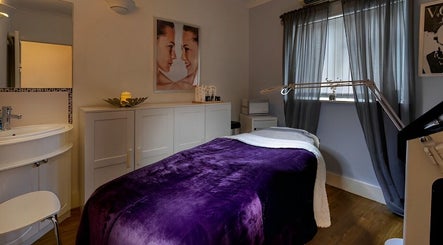 Calm treatment room at Farrah Brows & Aesthetic at SkinFit Clinic, Hampton, England, GB with cozy decor.
